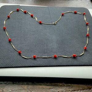 Chic 14K gold and salmon colored coral beads.